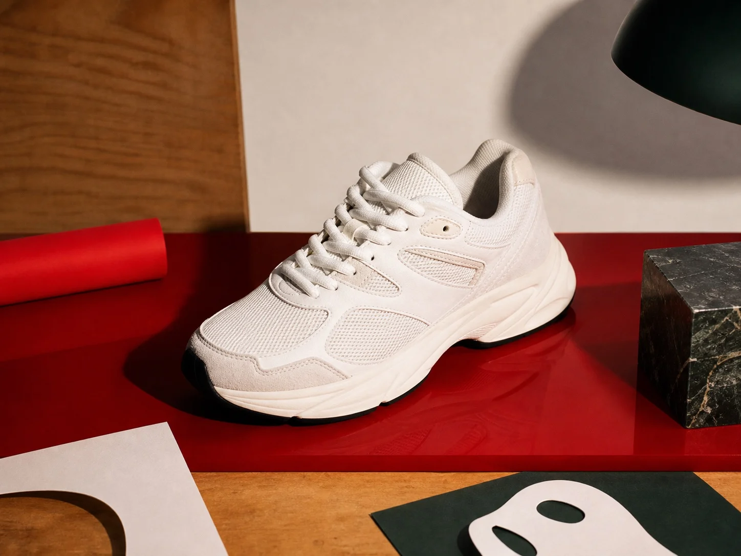 White sneaker styled with red campaign props